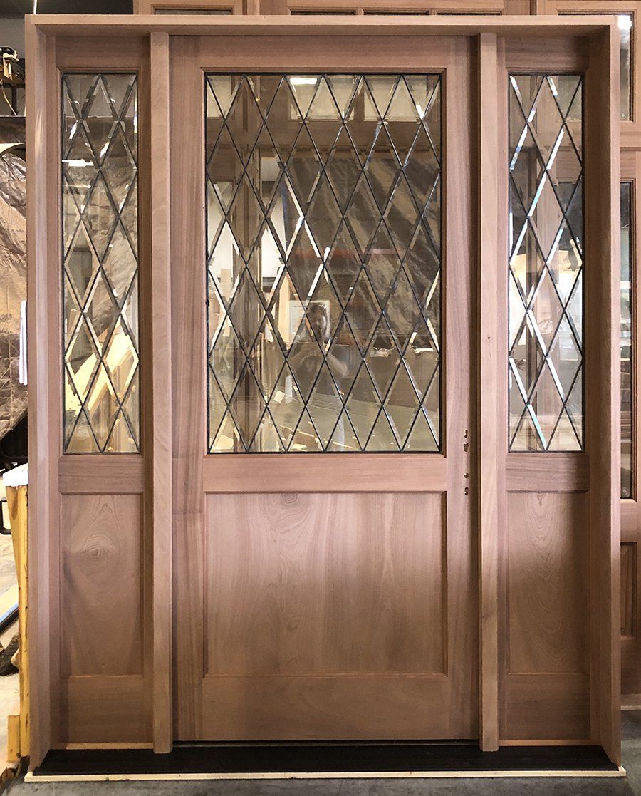Mahogany door with dark patina diamond beveled glass.