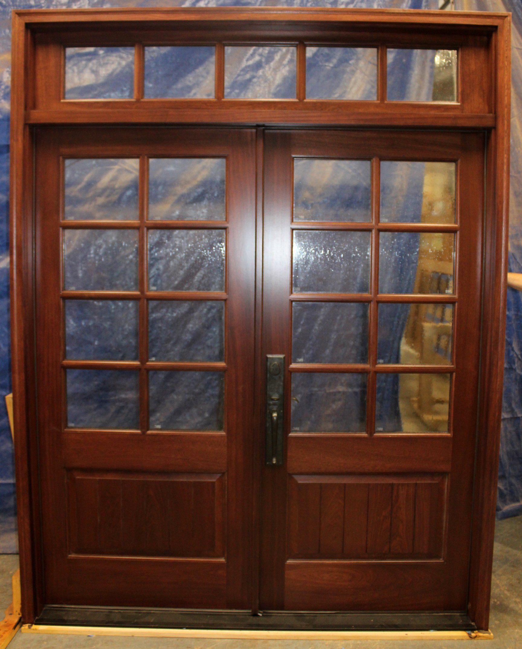 Mahogany door finished in a Rosewood color stain.  Old-English lockset Seeded glass