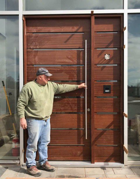Custom mahogany pivot door with sidelight