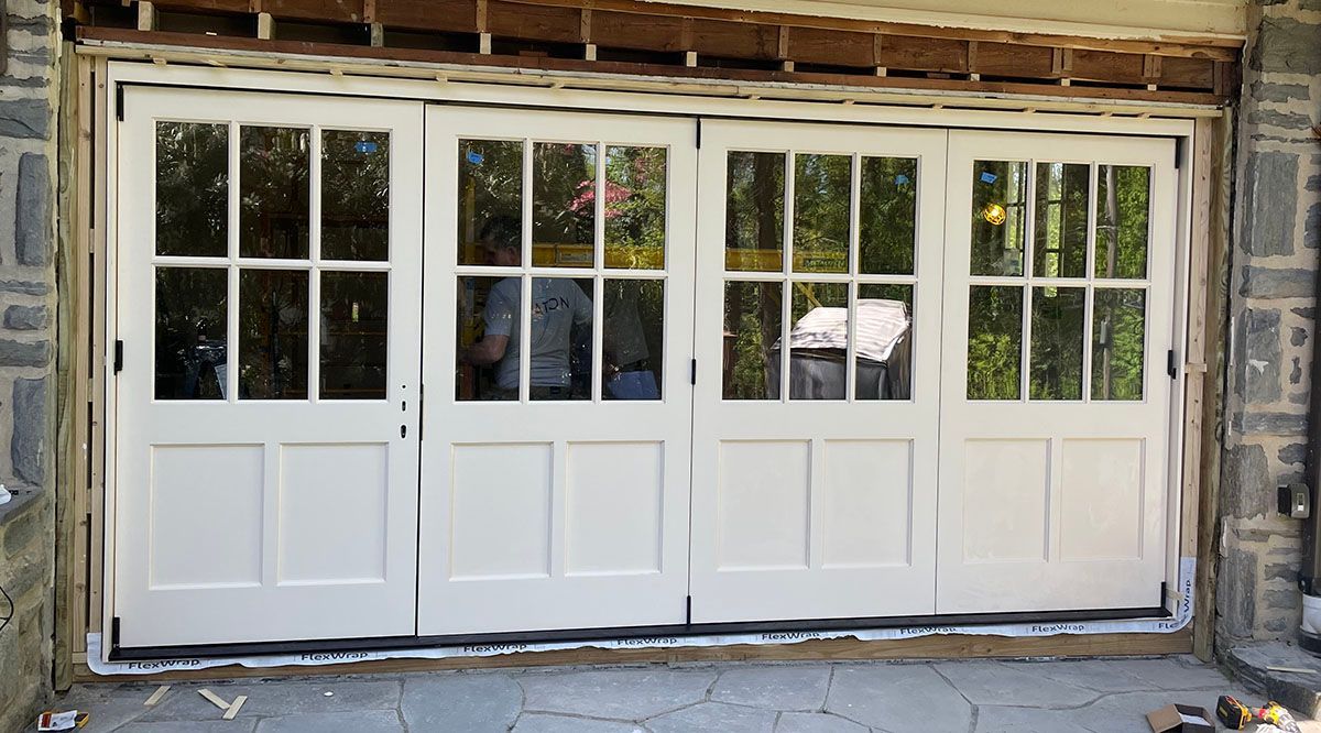 Curtis #28323 
Bifold Sapele Mahogany 15 foot wide door system
Factory custom painted exterior 