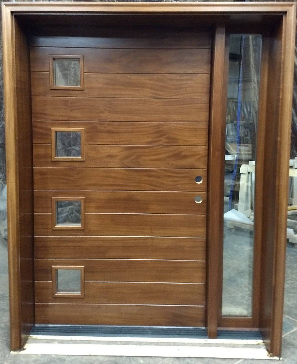 A wooden door with three square windows on it