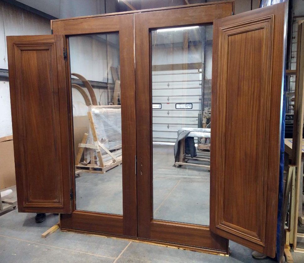 Mahogany double doors with operable interior shutters
