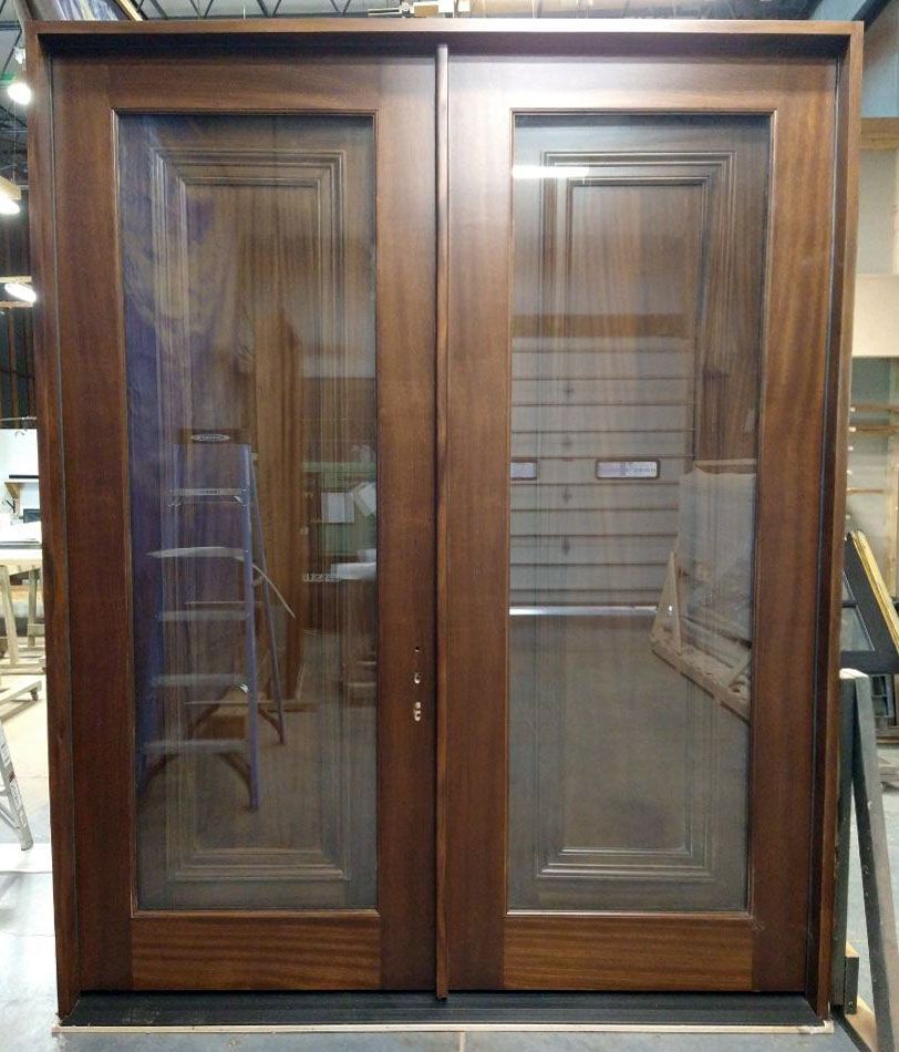 Icon #27664
Mahogany double doors with operable interior shutters
Finished in Chappo