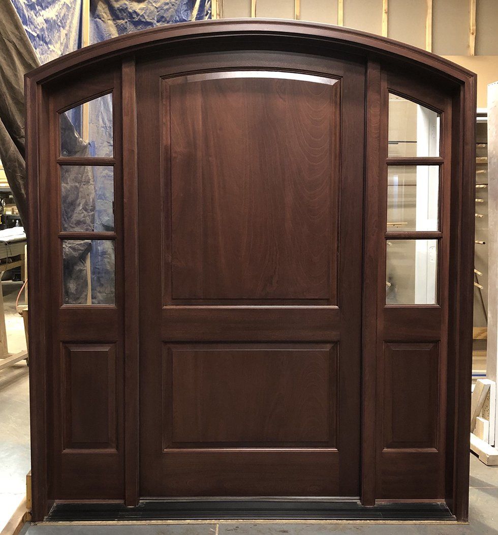 Mahogany arch top door with sidelights