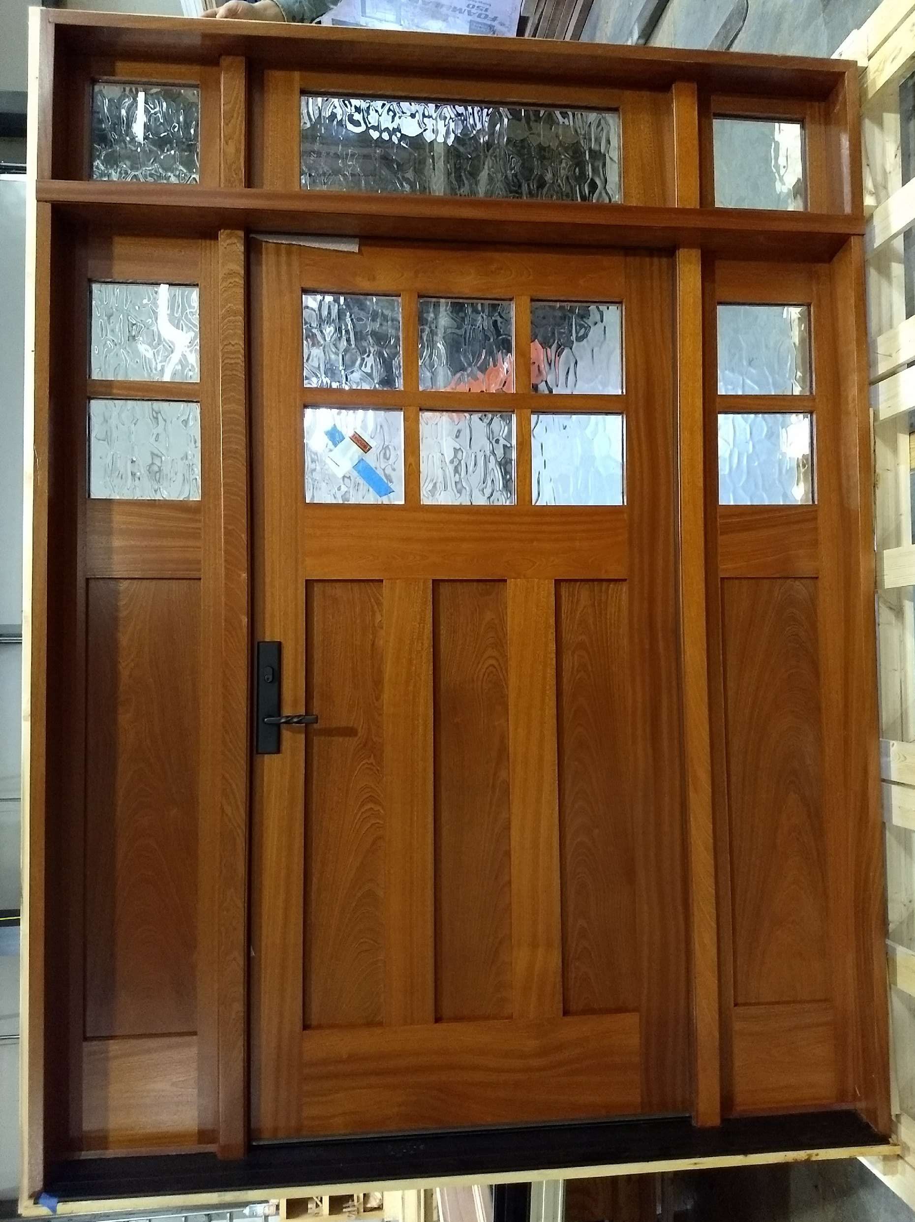Wood and flemish glass door with side windows and transom