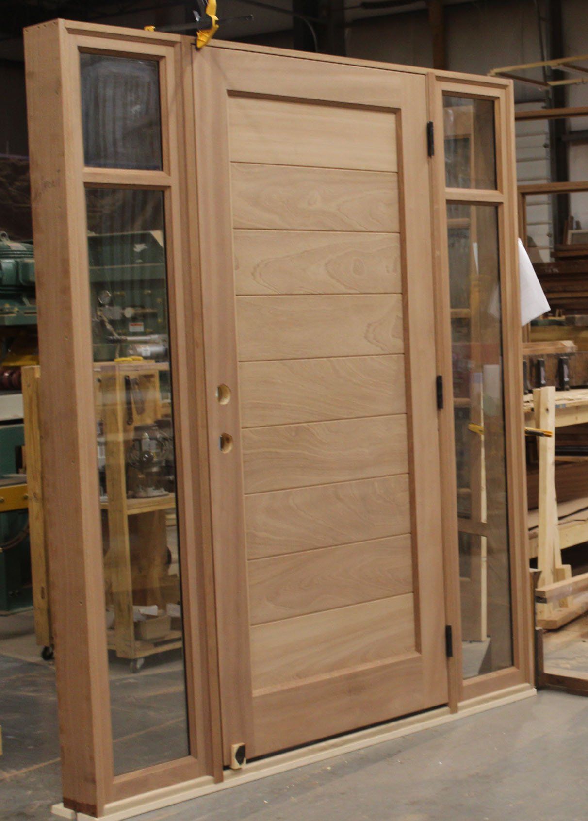 Modern mahogany planked panel entry door with 5 lite sidelites