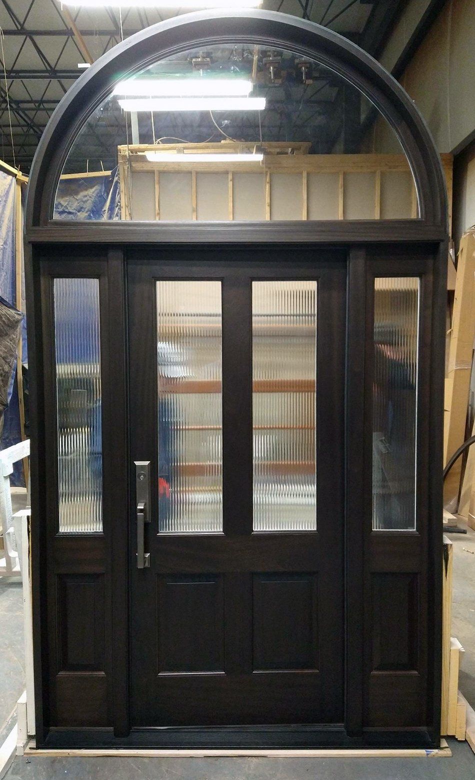 Mahogany entry door with reeded glass in door and sidelights and clear IG in half round transom