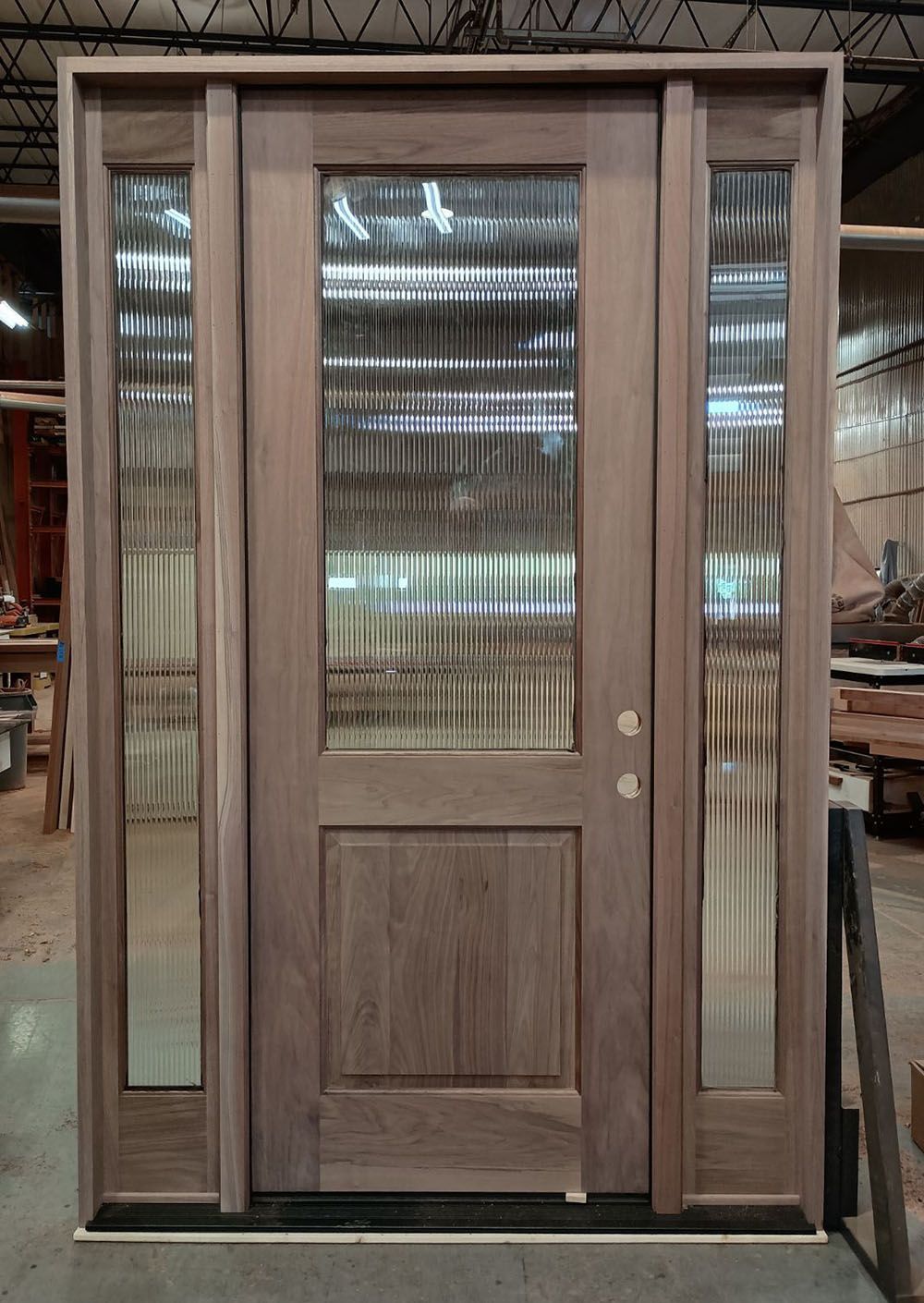 Beach Haven #28411
American Walnut, triple door unit, 2 1/4” door with reeded glass over single raised panel and full view 1 3/4”sidelites. Shown unfinished