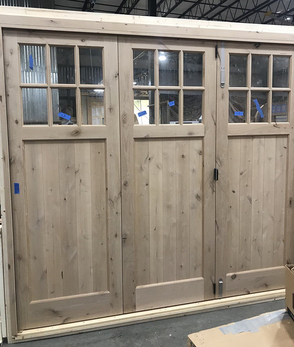 Knotty Alder wood folding exterior door unit stacks to one side