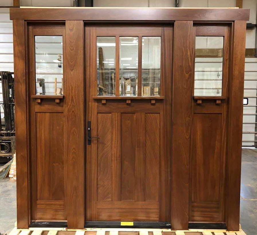 Mahogany craftsman style door with sidelights