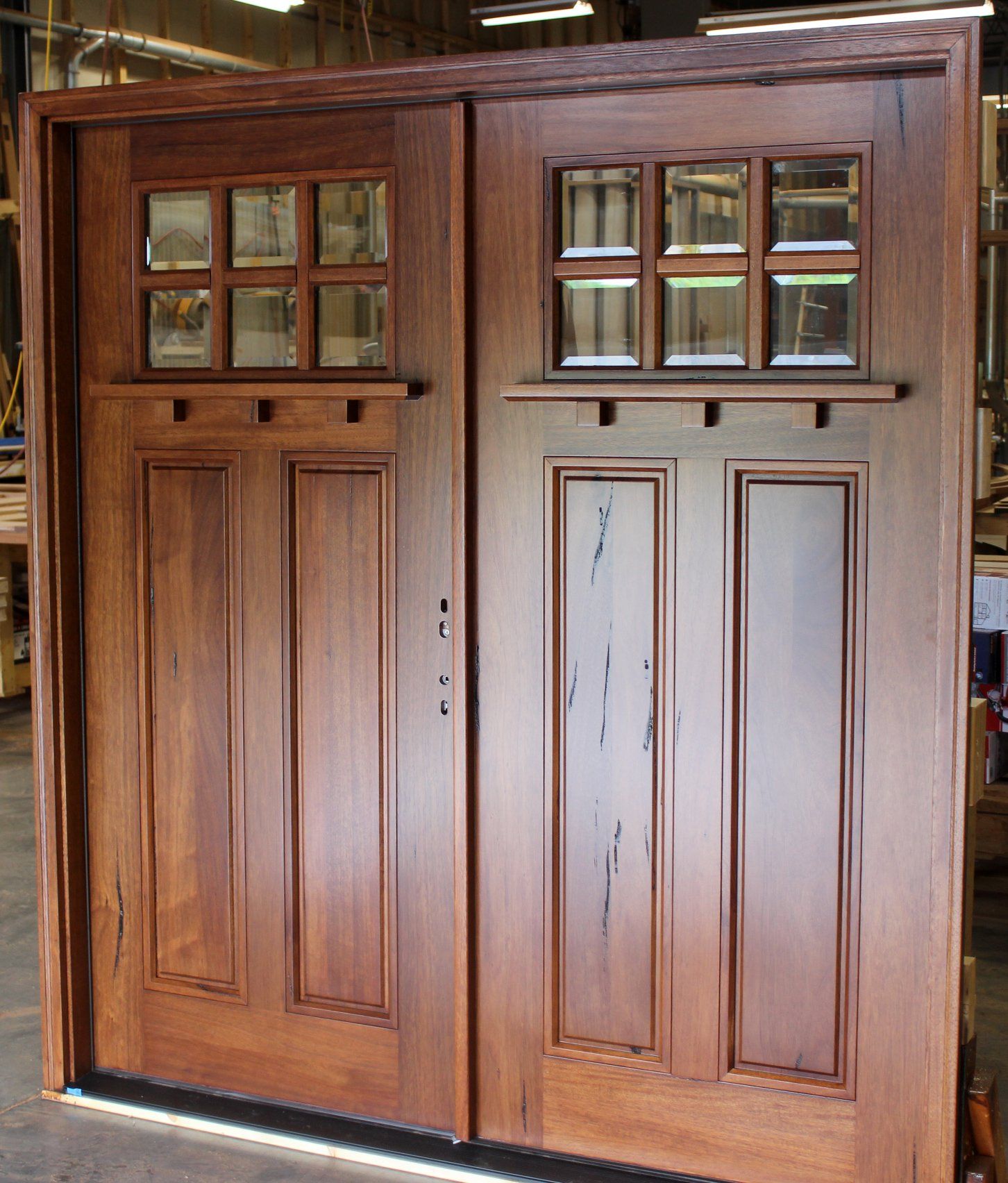 Walnut wood double entry door with dentil shelf
