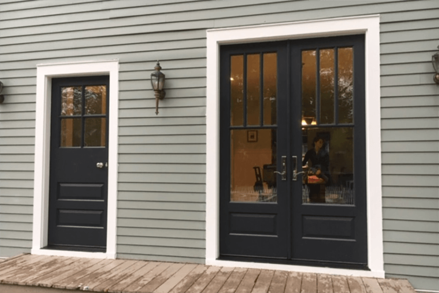 Mahogany doors painted black on exterior and white on interior