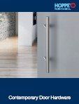 A picture of a stainless steel door handle on a door.