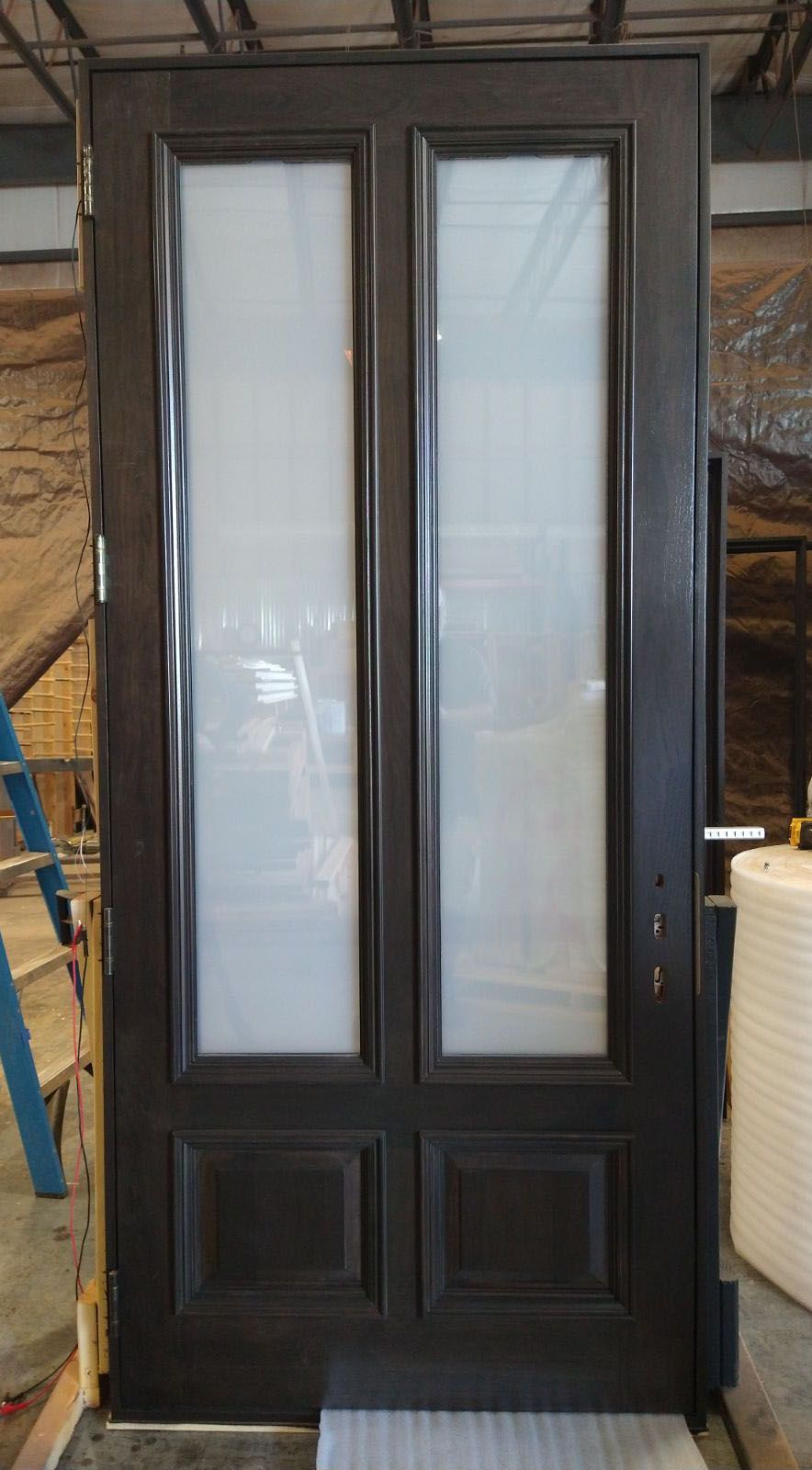 Walnut door with applied molding and electronic switchable glass