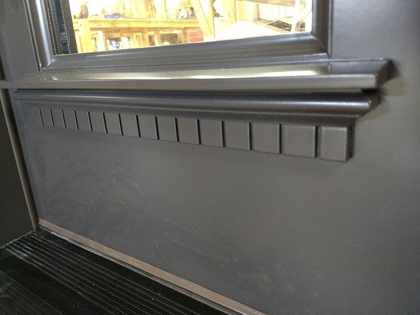 A close up of a window sill on a door.