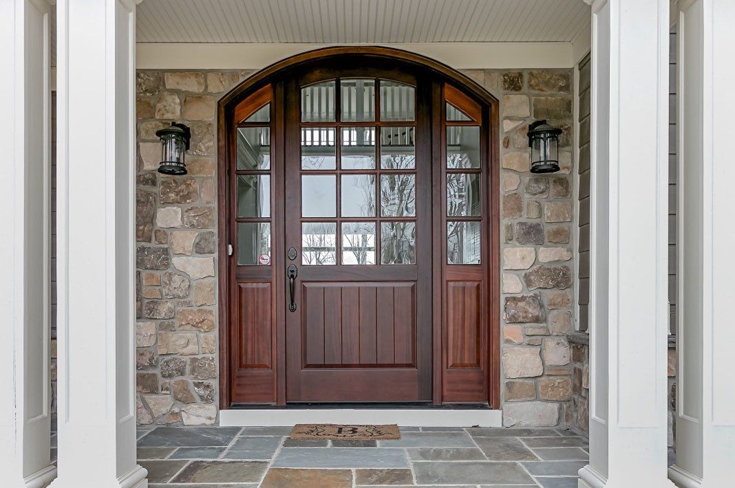 Lawn Ave arched top entry door with sidelights