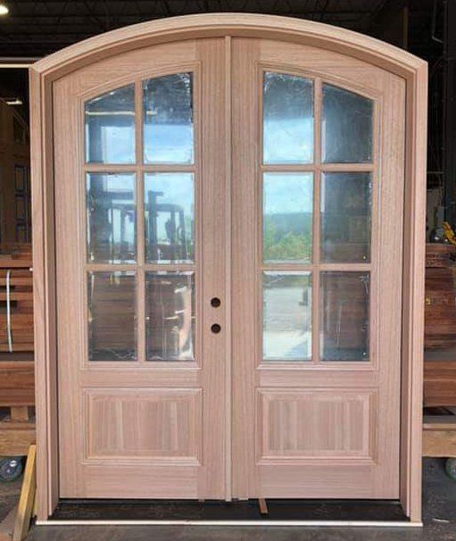 Eyebrow top double door unit with 6 glass panes in each door