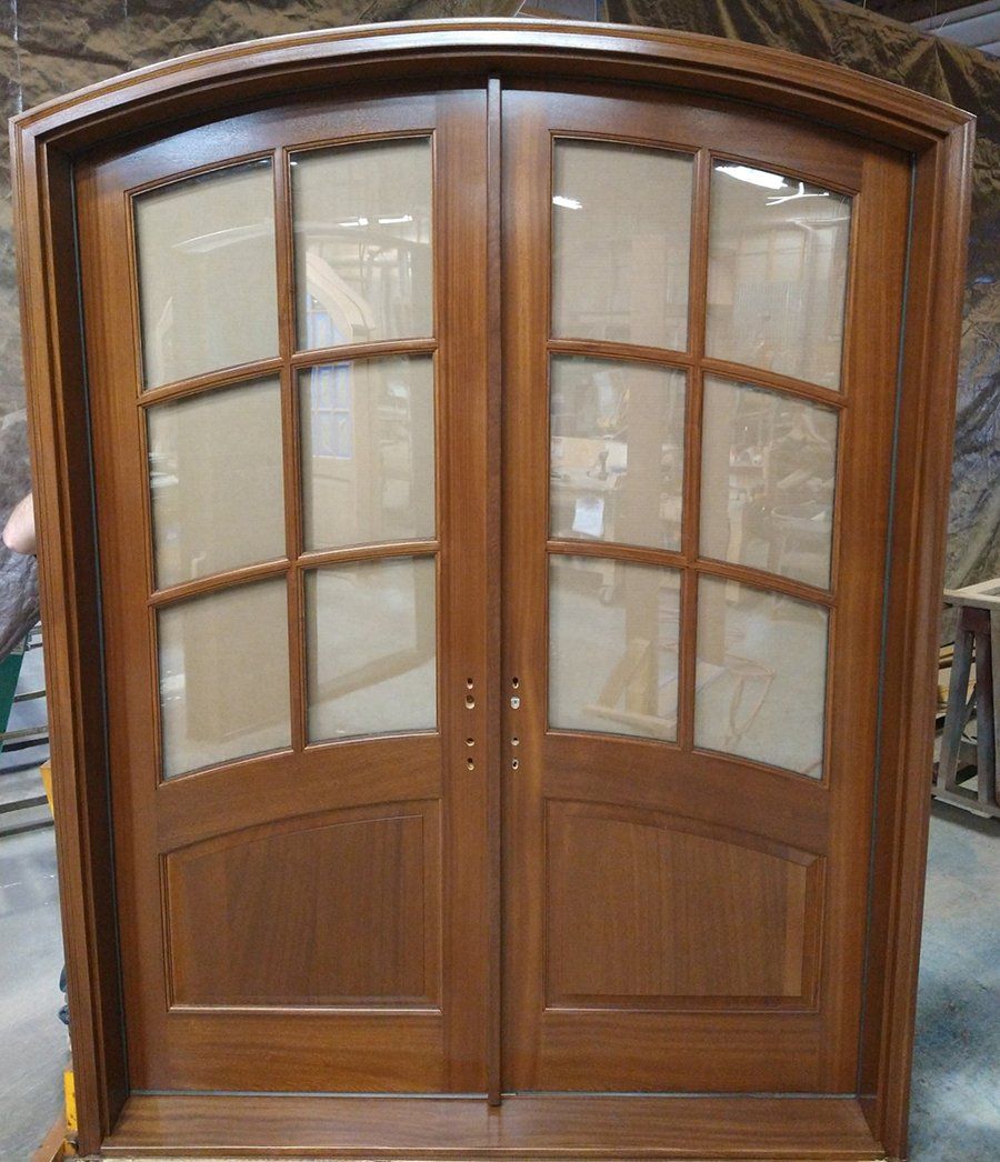 Eyebrow arched double door unit in mahogany