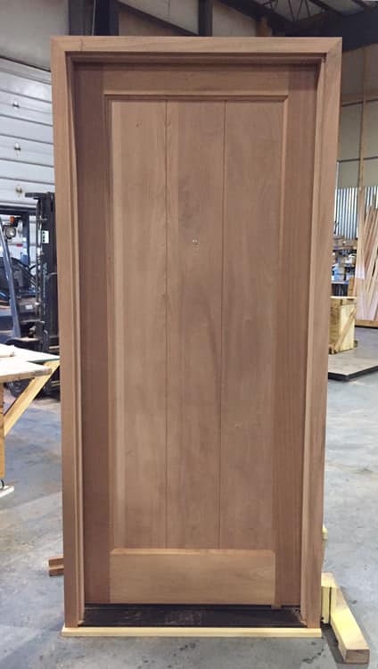Solid mahogany exterior door with 3 planked panels.