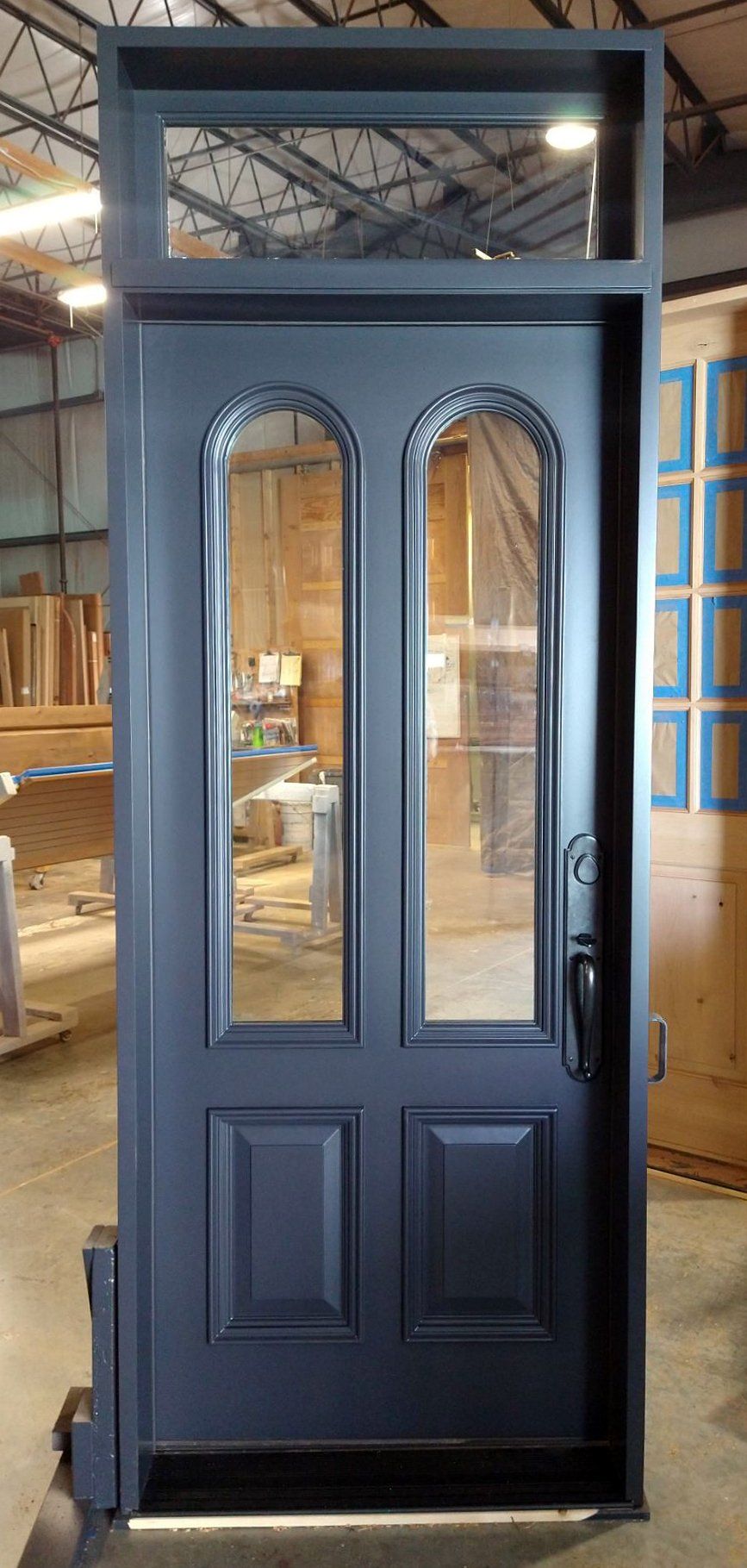 Paint grade mahogany exterior door with bullet arches