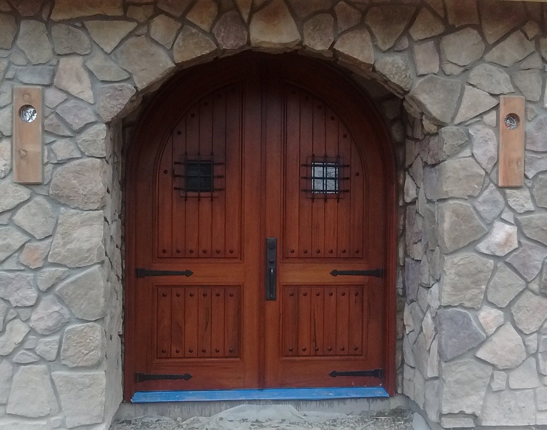 Solid wood door flanked by two 24