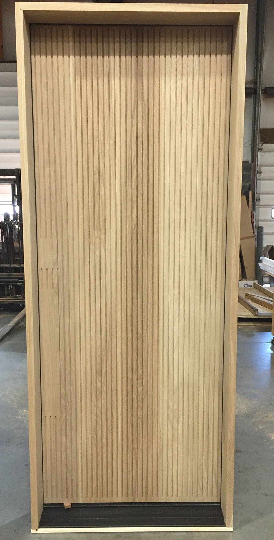 White oak modern fluted door Tectus hidden hinges