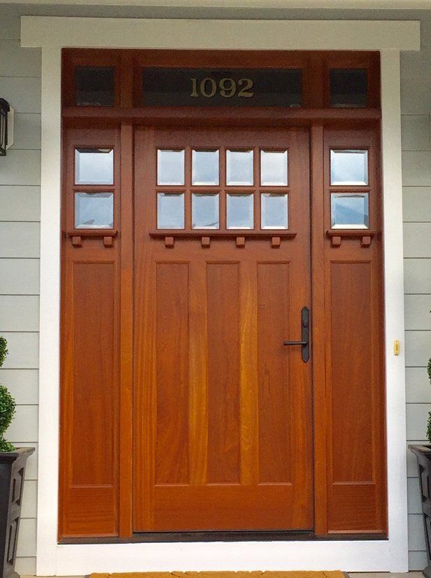 Sapele Mahogany Craftsman style door factory finished in Honey.