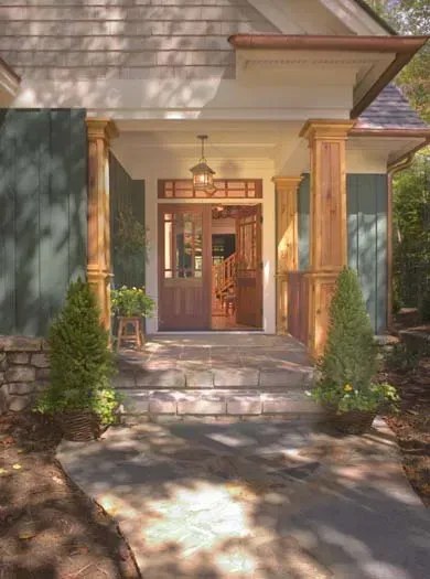 The front door of a house with a stone walkway leading to it.