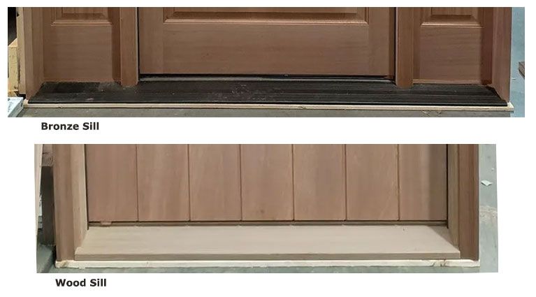 A door with a wood sill and a bronze sill