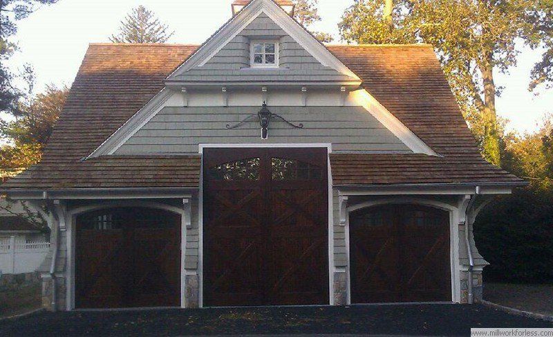 A garage with a roof that has a window on it