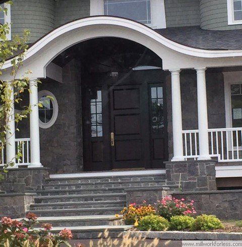 The front of a house with a porch and stairs