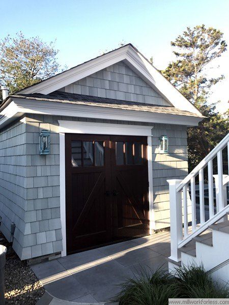 A garage with a staircase leading up to it