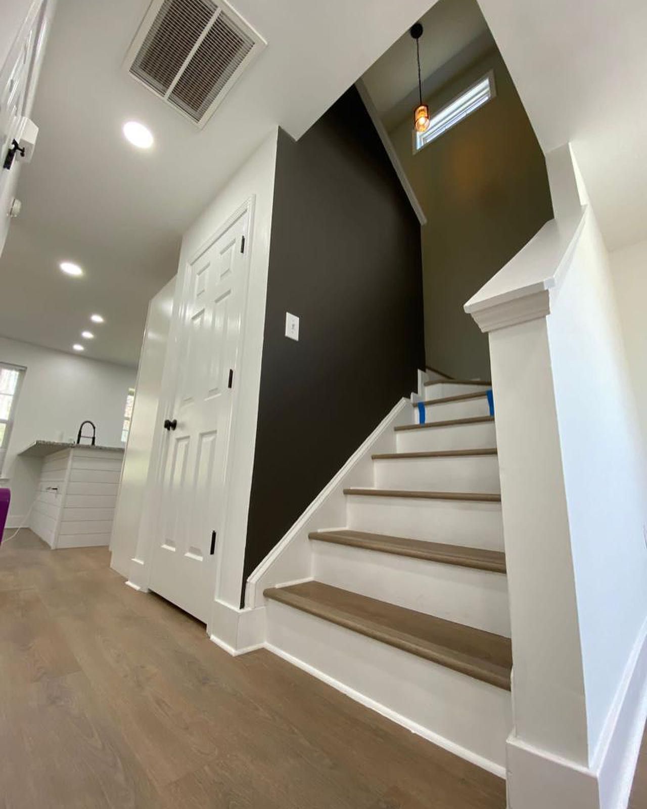 A staircase leading up to the second floor of a house