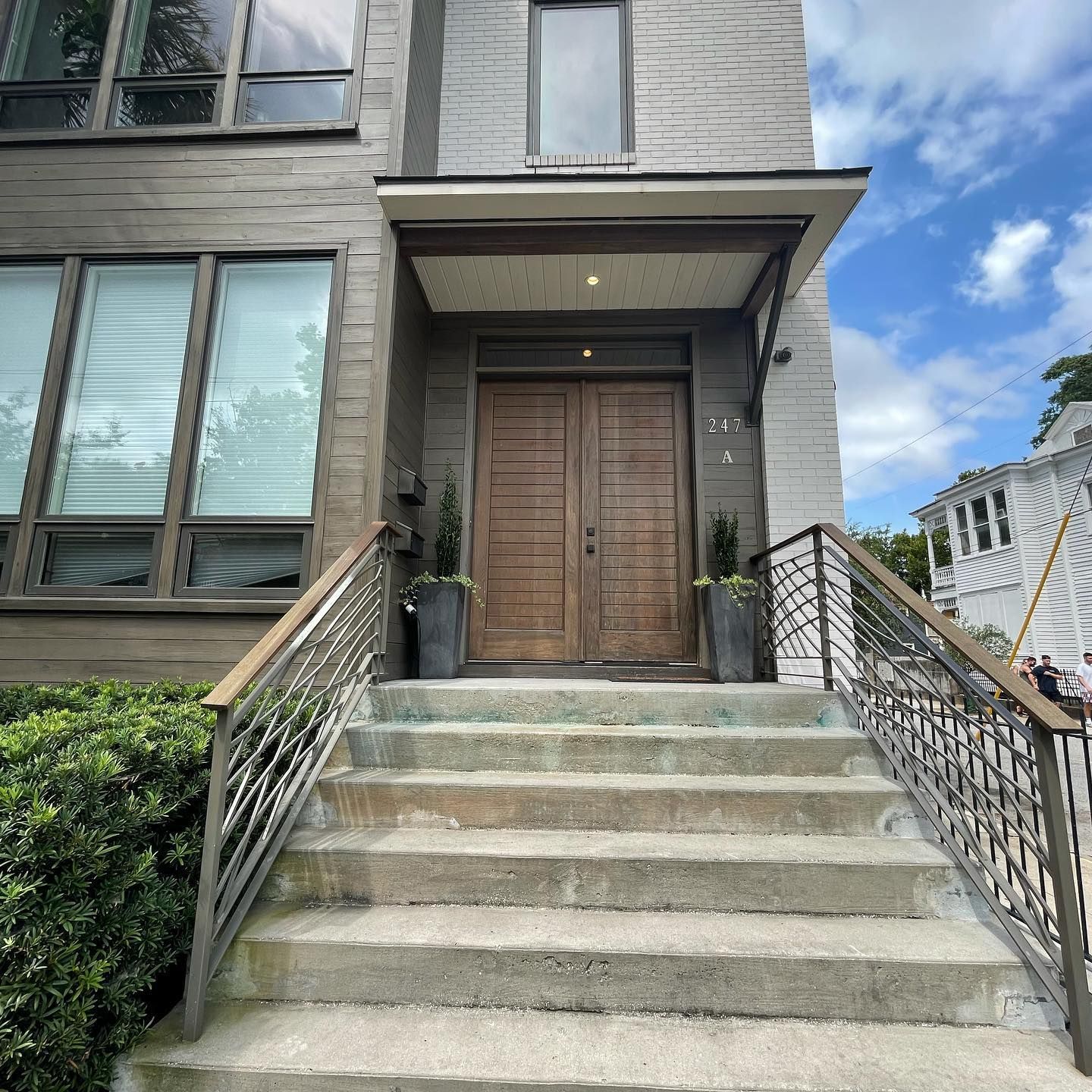 A house with stairs leading up to the front door
