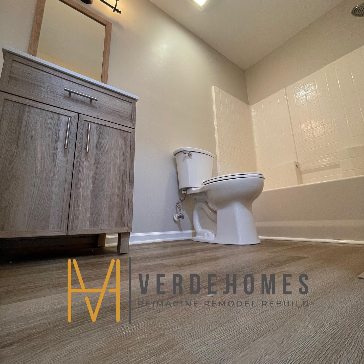 A bathroom with a toilet and a bathtub by verdehomes