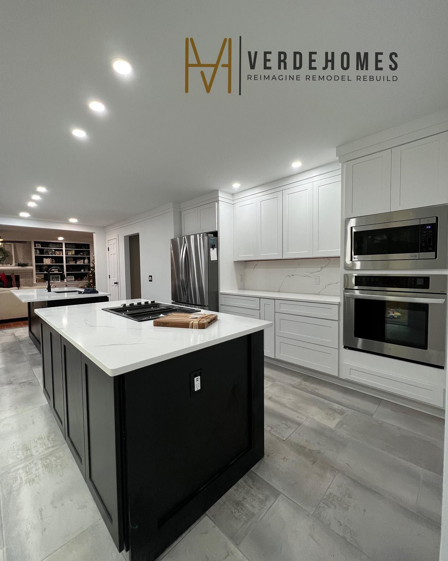 A kitchen with stainless steel appliances and a large island