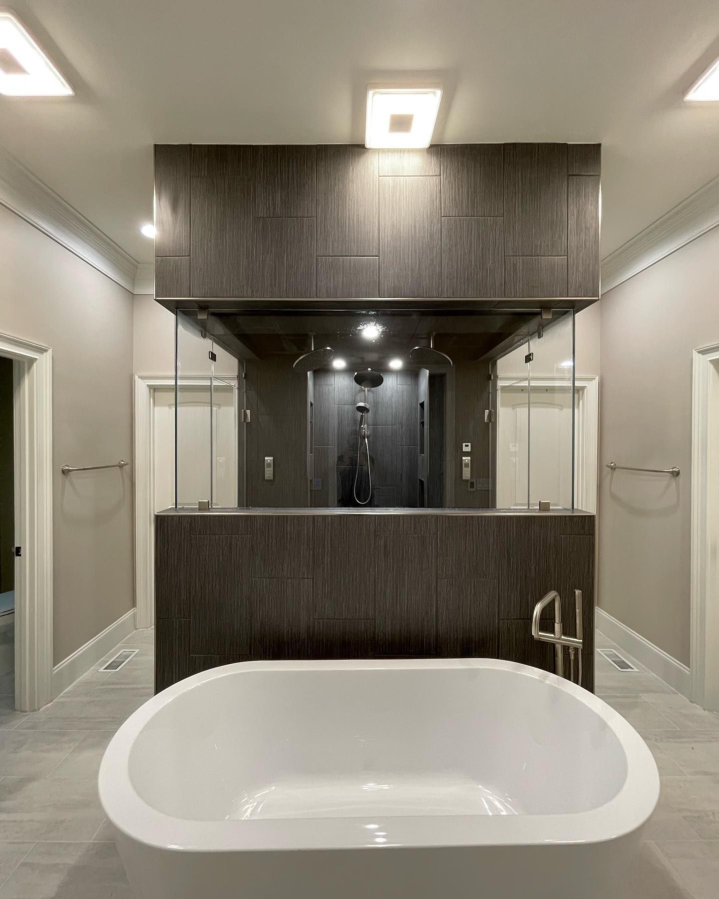 There is a large bathtub in the middle of the bathroom.