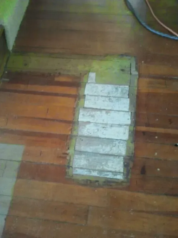 There is a hole in the floor that looks like a piano keyboard.