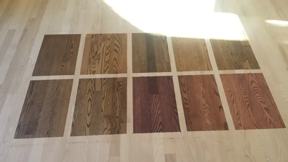 A wooden floor with different shades of wood on it