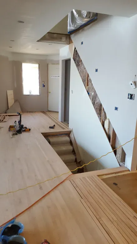 A staircase is being built in a house under construction