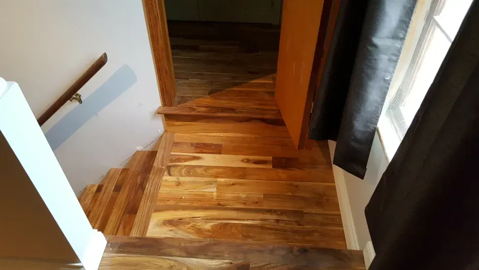 A wooden staircase leading up to the second floor of a house.