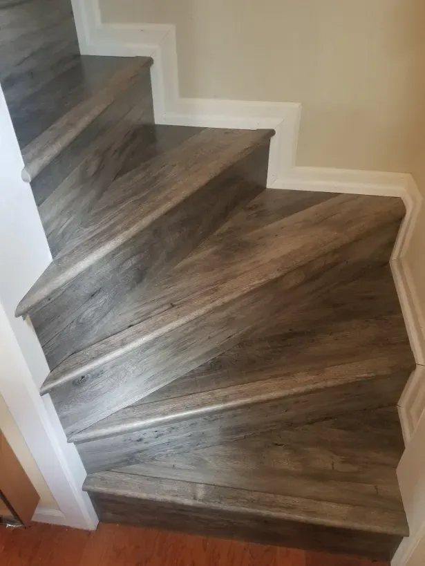 A set of stairs with wooden steps in a house.
