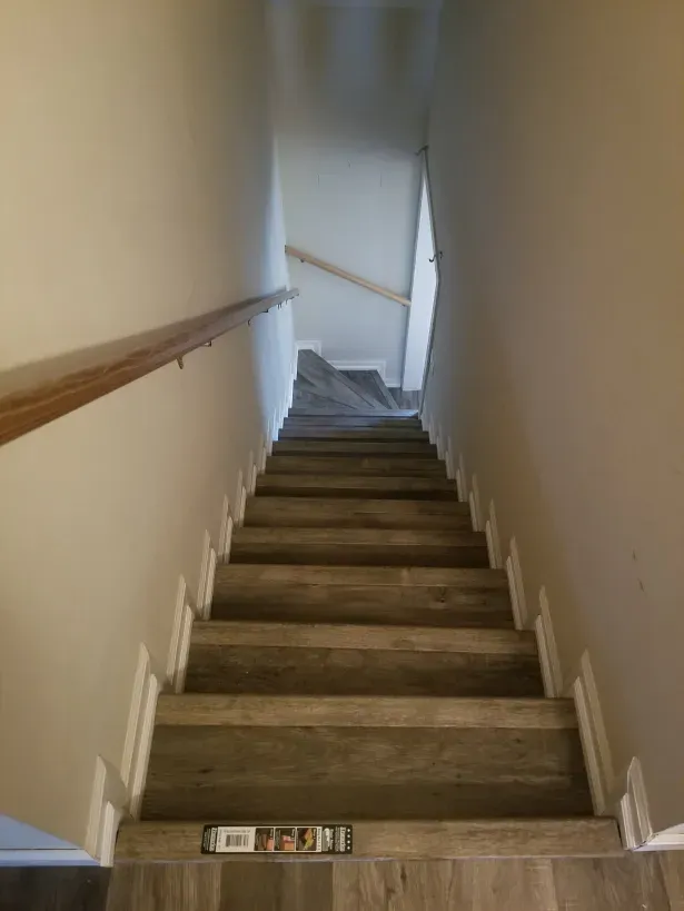 A set of stairs leading up to the second floor of a house.