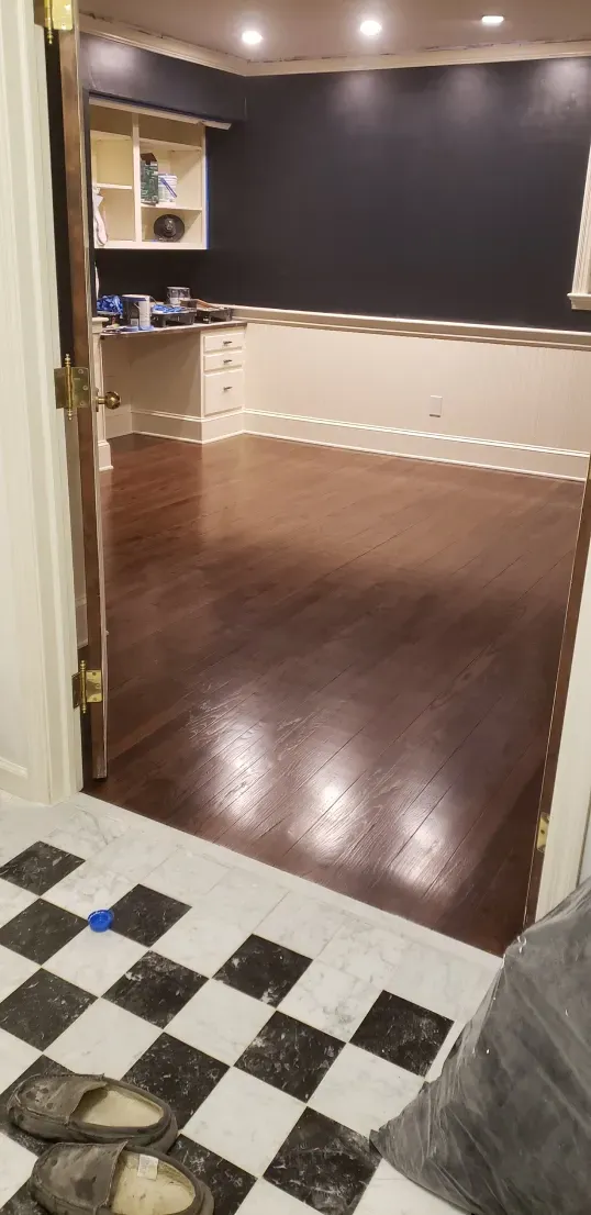 A room with a wooden floor and a checkered floor.
