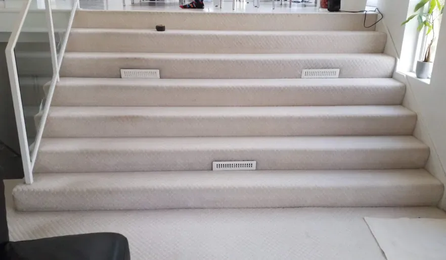 A set of stairs leading up to a second floor in a house.