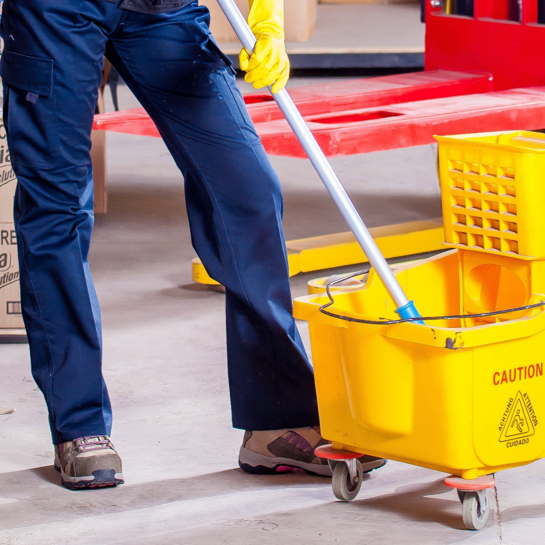 A yellow bucket with the word caution on it