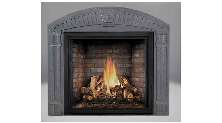 Gray fireplace with a burning fire and logs inside a dark firebox
