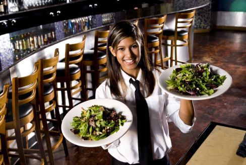 Waitress with salad in restaurant in Bentleigh East