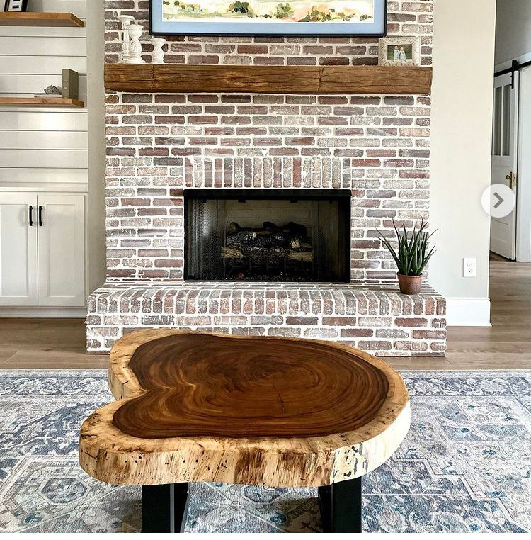 A dining room with a table and chairs and a chandelier
