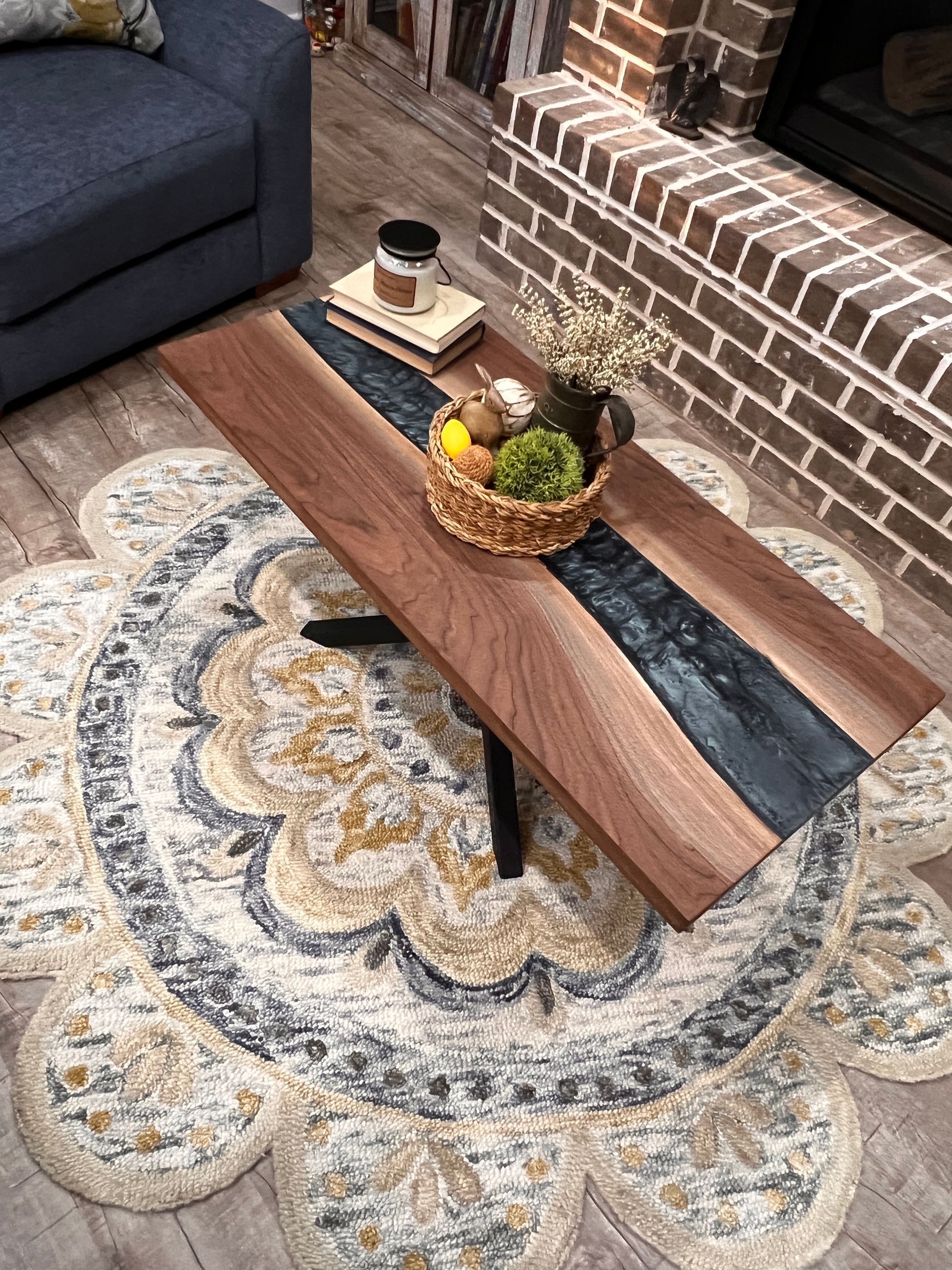 A wooden table with a blue river in the middle